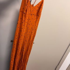 orange polka dot free people jumpsuit